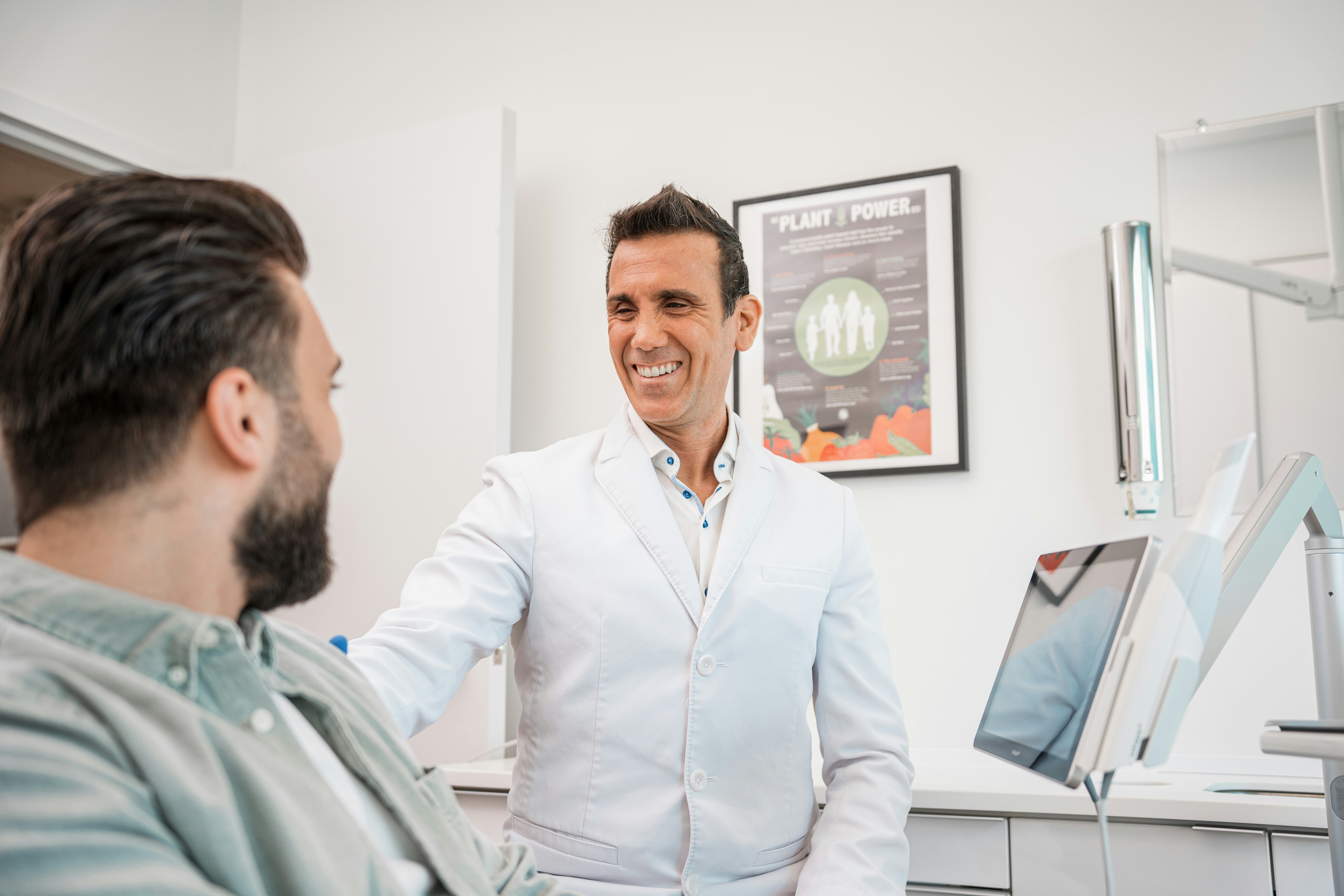Doctor consulting with a patient about critical illness insurance protection options